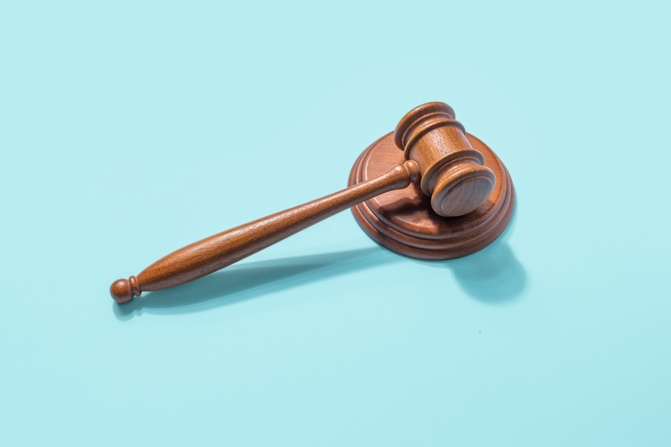 Law,And,Order,Concept.,Gavel,Judge,On,A,Blue,Background