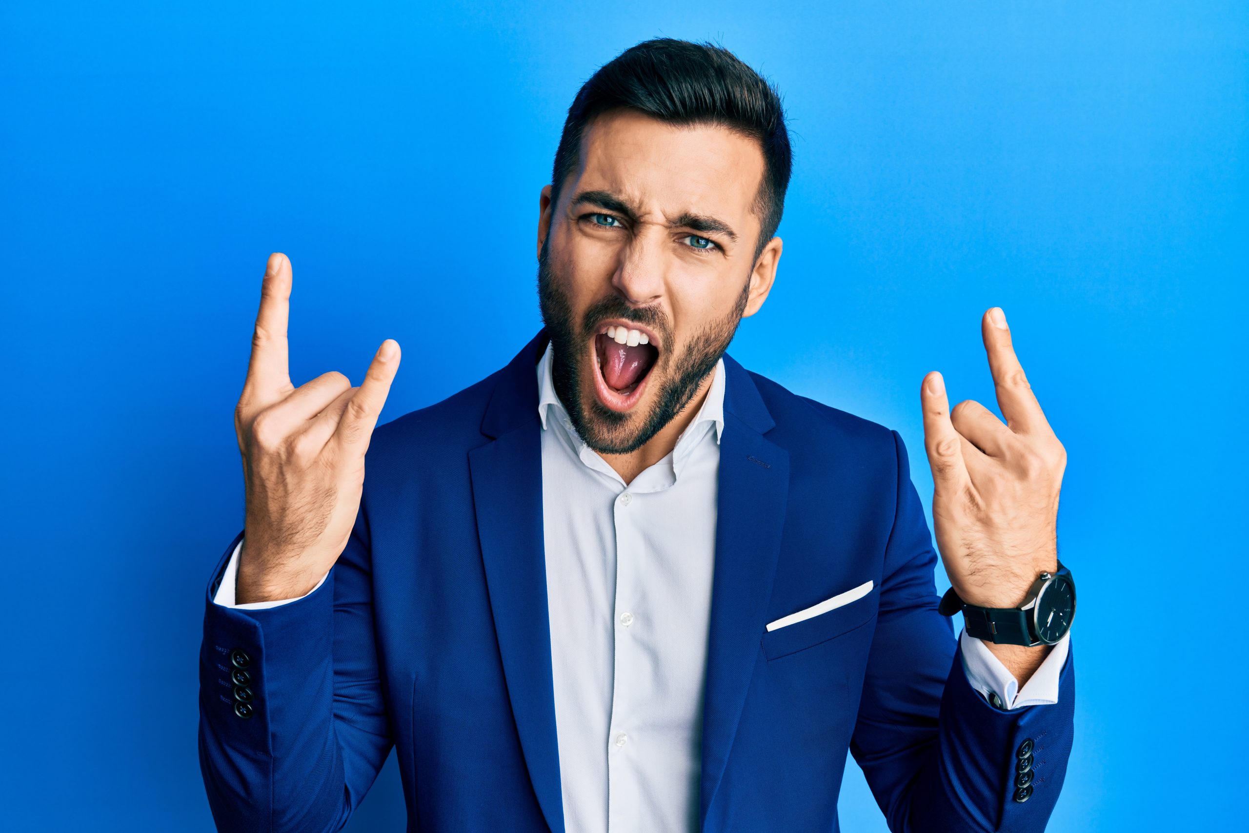 Young,Hispanic,Businessman,Wearing,Business,Jacket,Shouting,With,Crazy,Expression