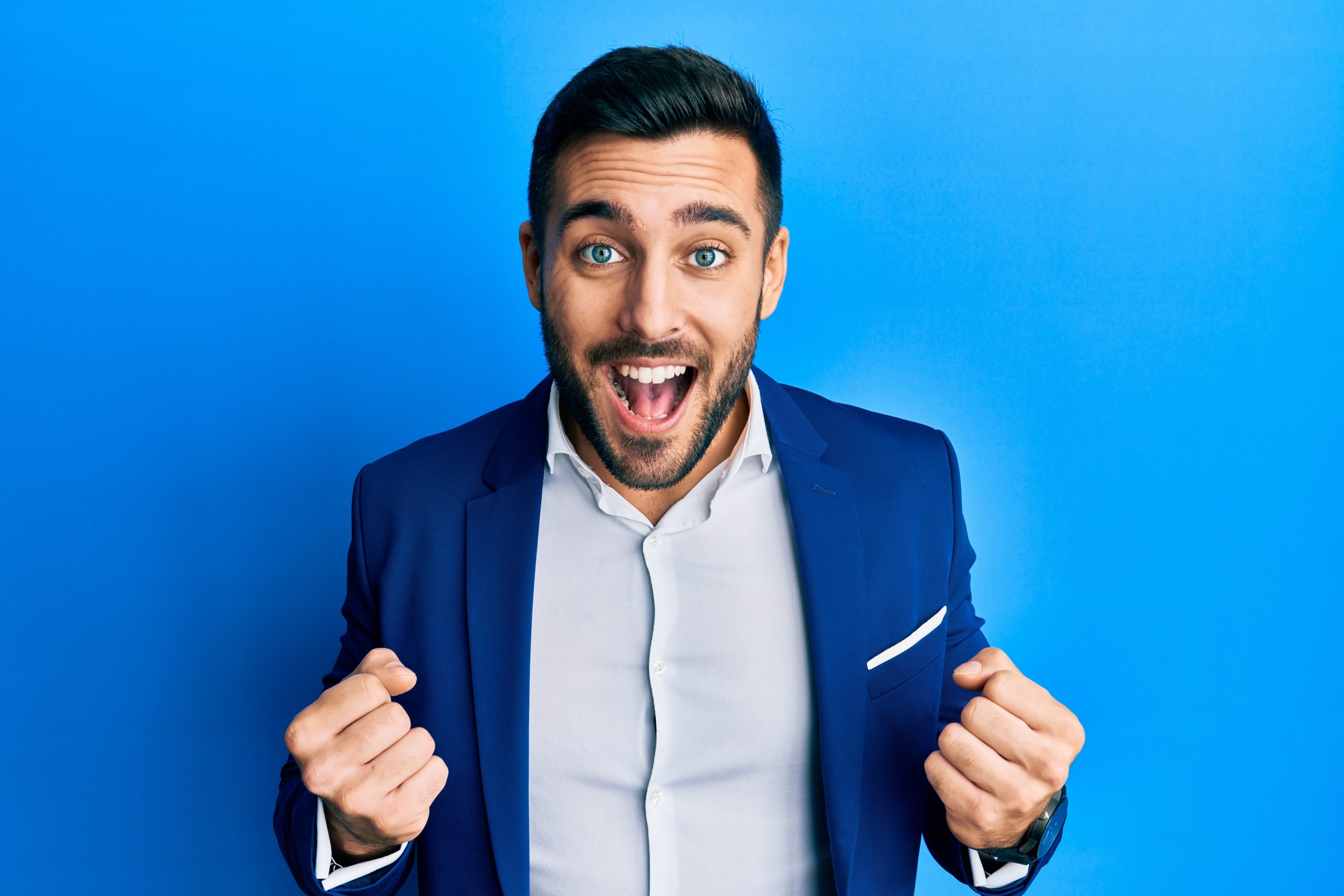 Young,Hispanic,Businessman,Wearing,Business,Jacket,Celebrating,Surprised,And,Amazed