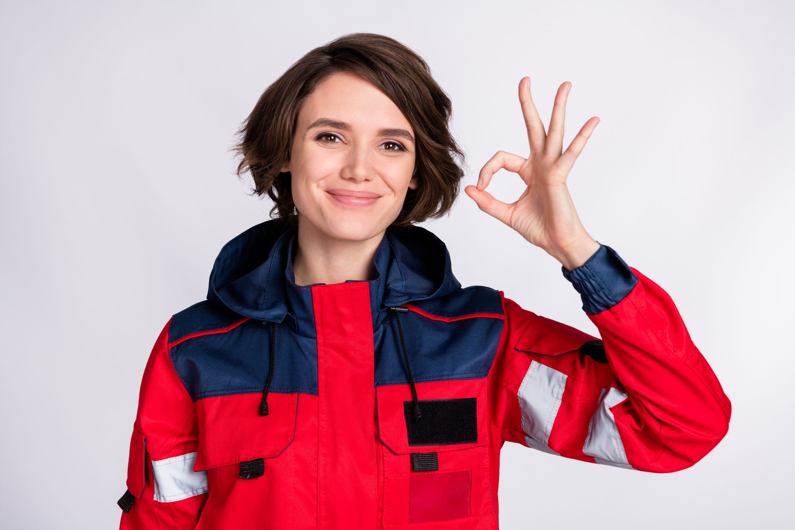Photo,Of,Young,Happy,Lovely,Cheerful,Smiling,Girl,Paramedic,Showing