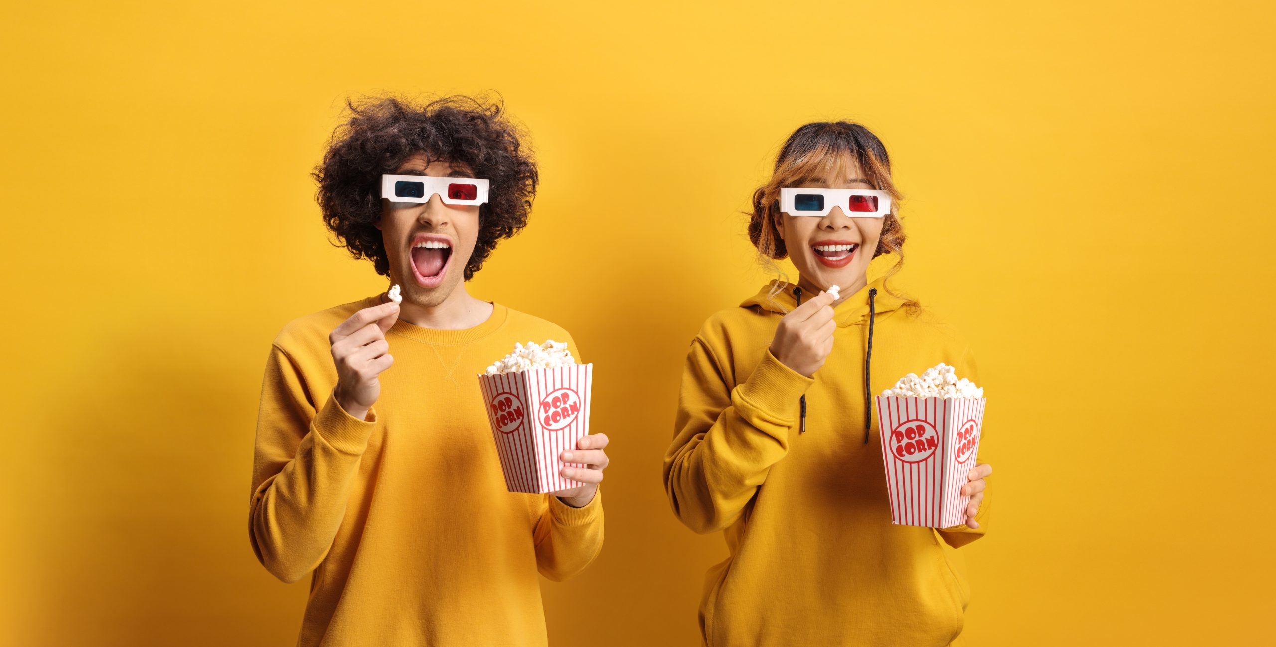 Excited,Man,And,Woman,Yellow,Sweatshirts,With,3d,Cinema,Glasses
